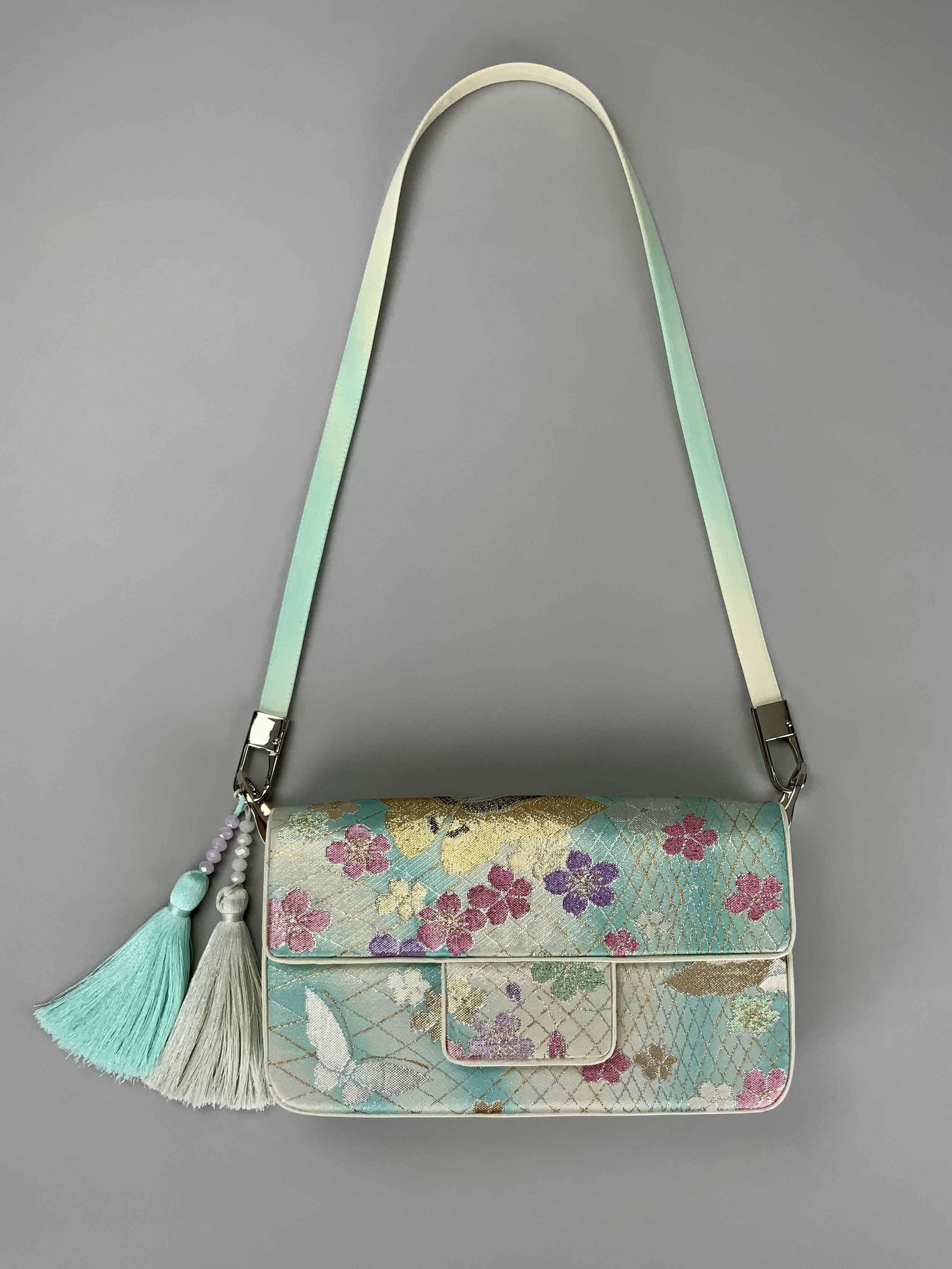 Aqua ombre evening bag made from vintage obi silk with pastel gold butterfly and blossom design by Kirsty Chivers
