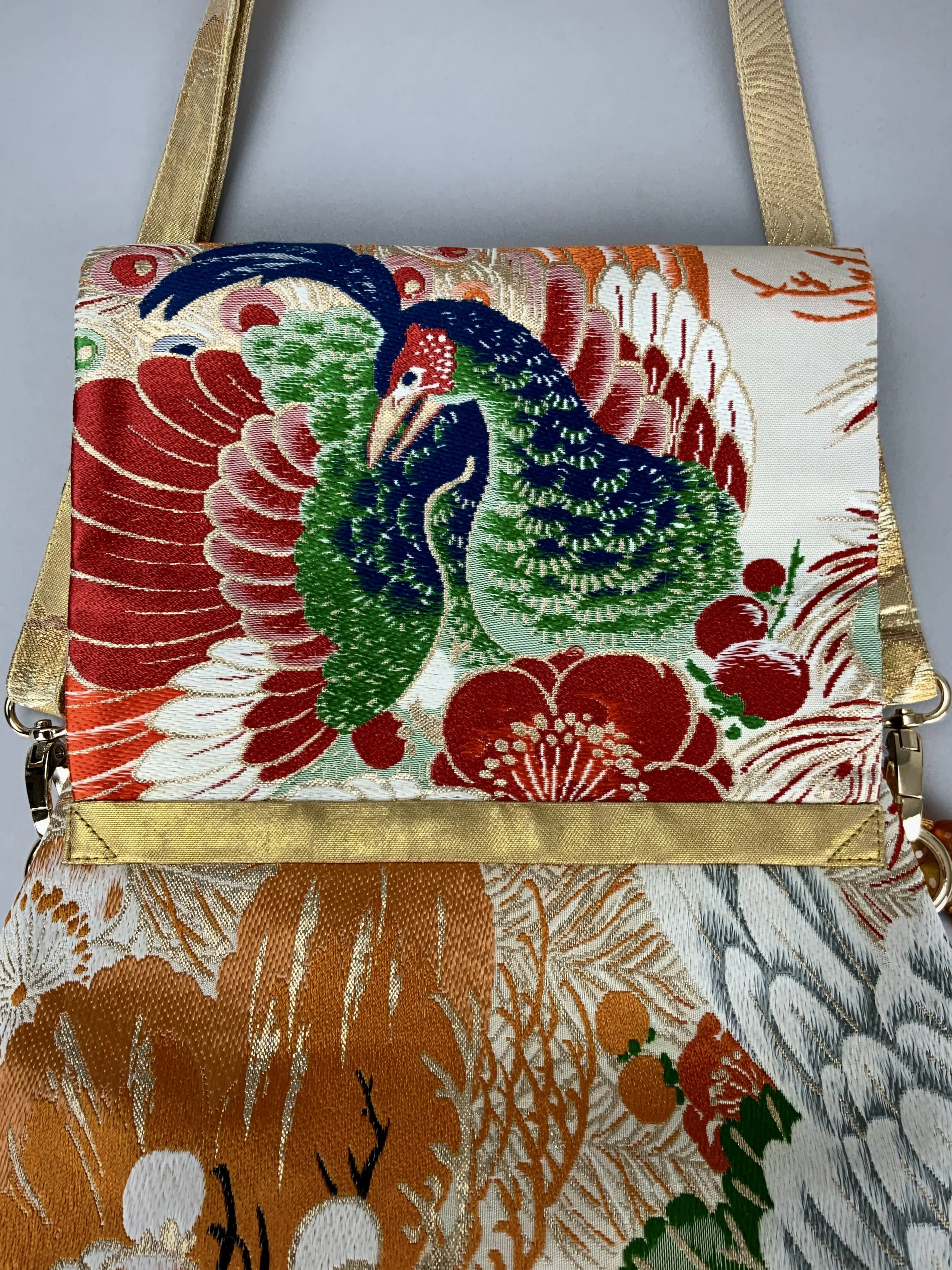 One-of-a-kind evening bag in vintage obi silk with peacock, pine motifs & gold accents