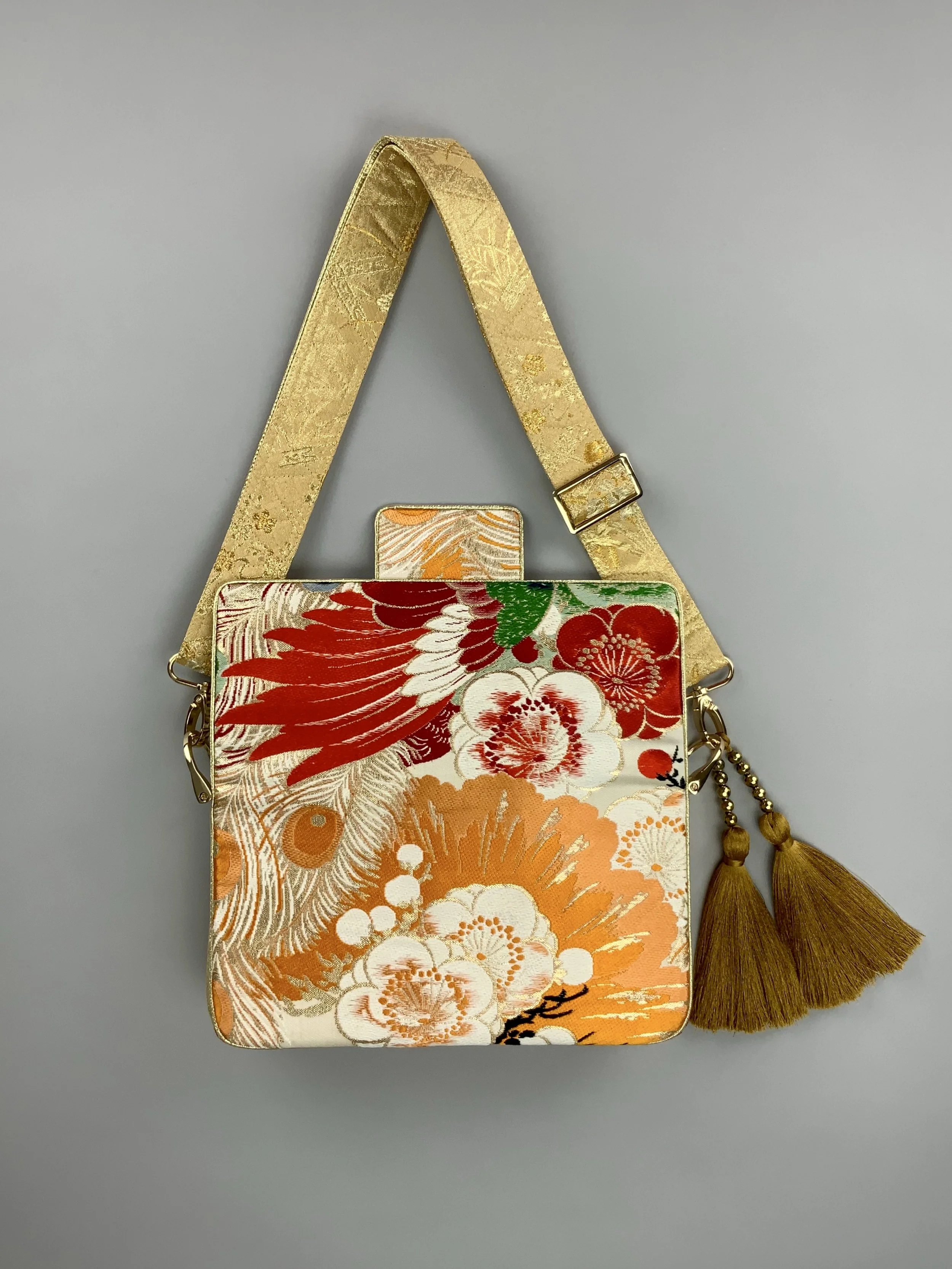Unique evening bag in vintage obi silk with peacock, pine motifs & gold accents by Kirsty Chivers