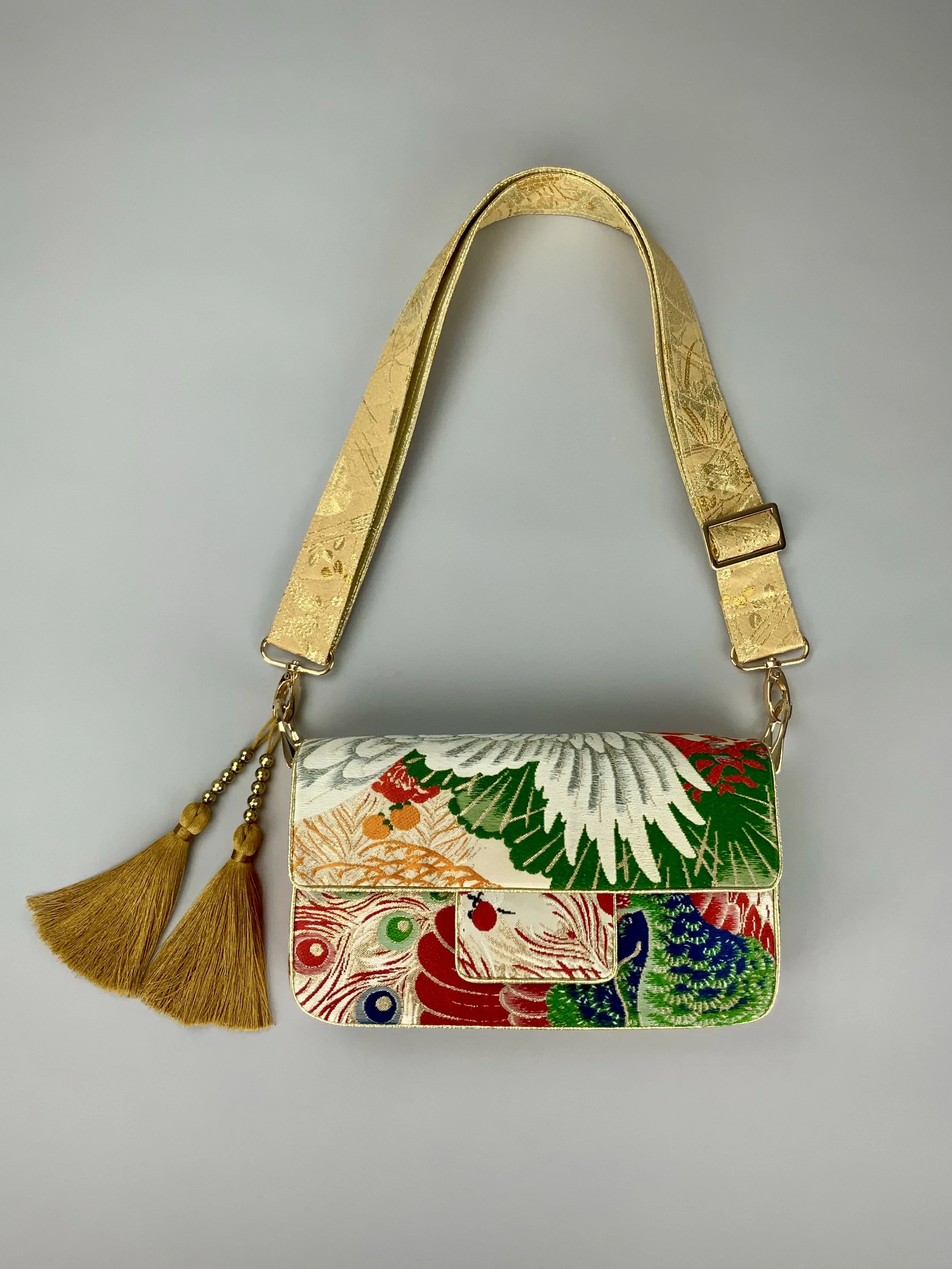 Unique evening bag in vintage obi silk with peacock, pine motifs & gold accents by Kirsty Chivers