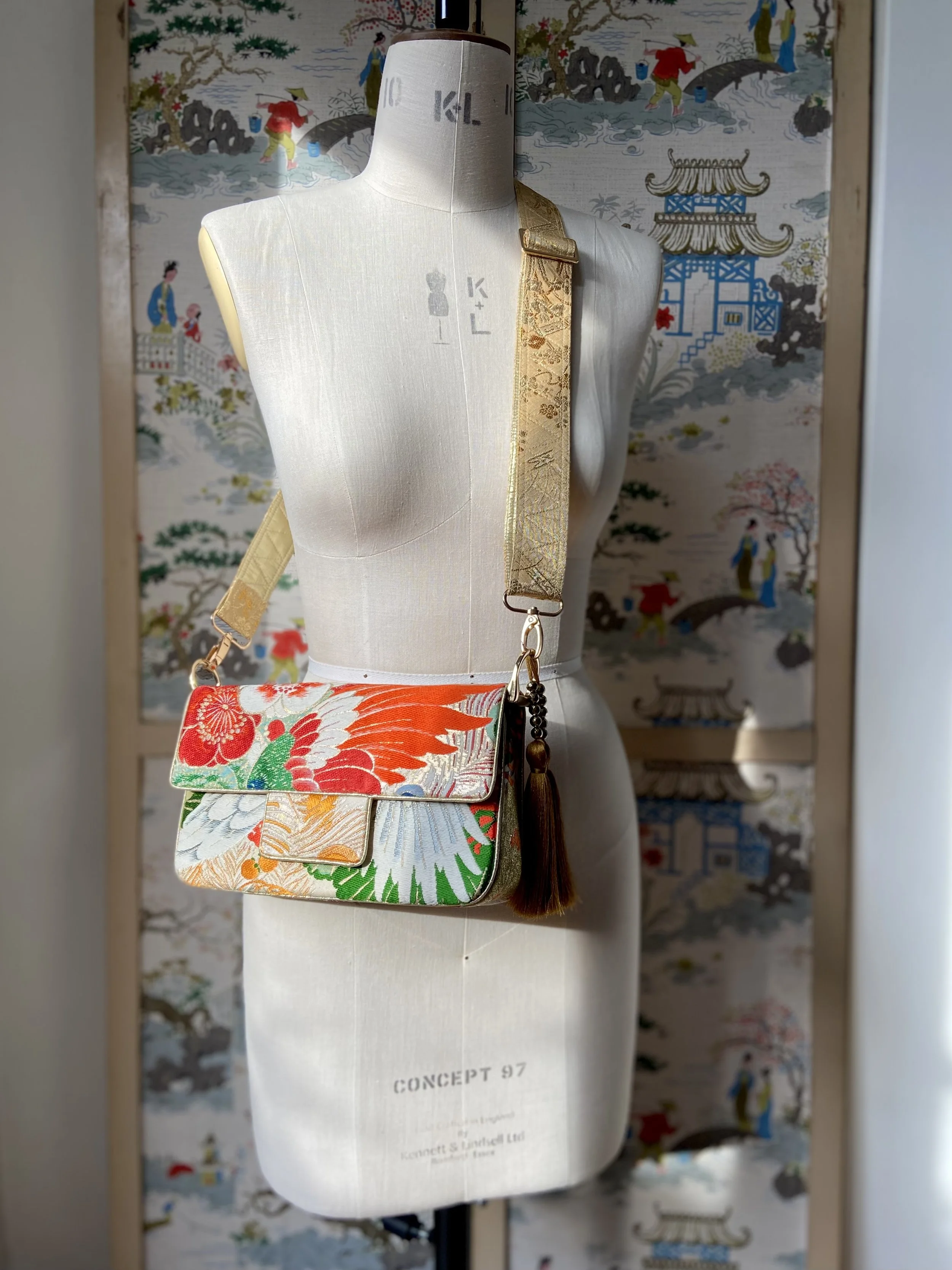 Unique evening bag in vintage obi silk with peacock, pine motifs & gold accents by Kirsty Chivers