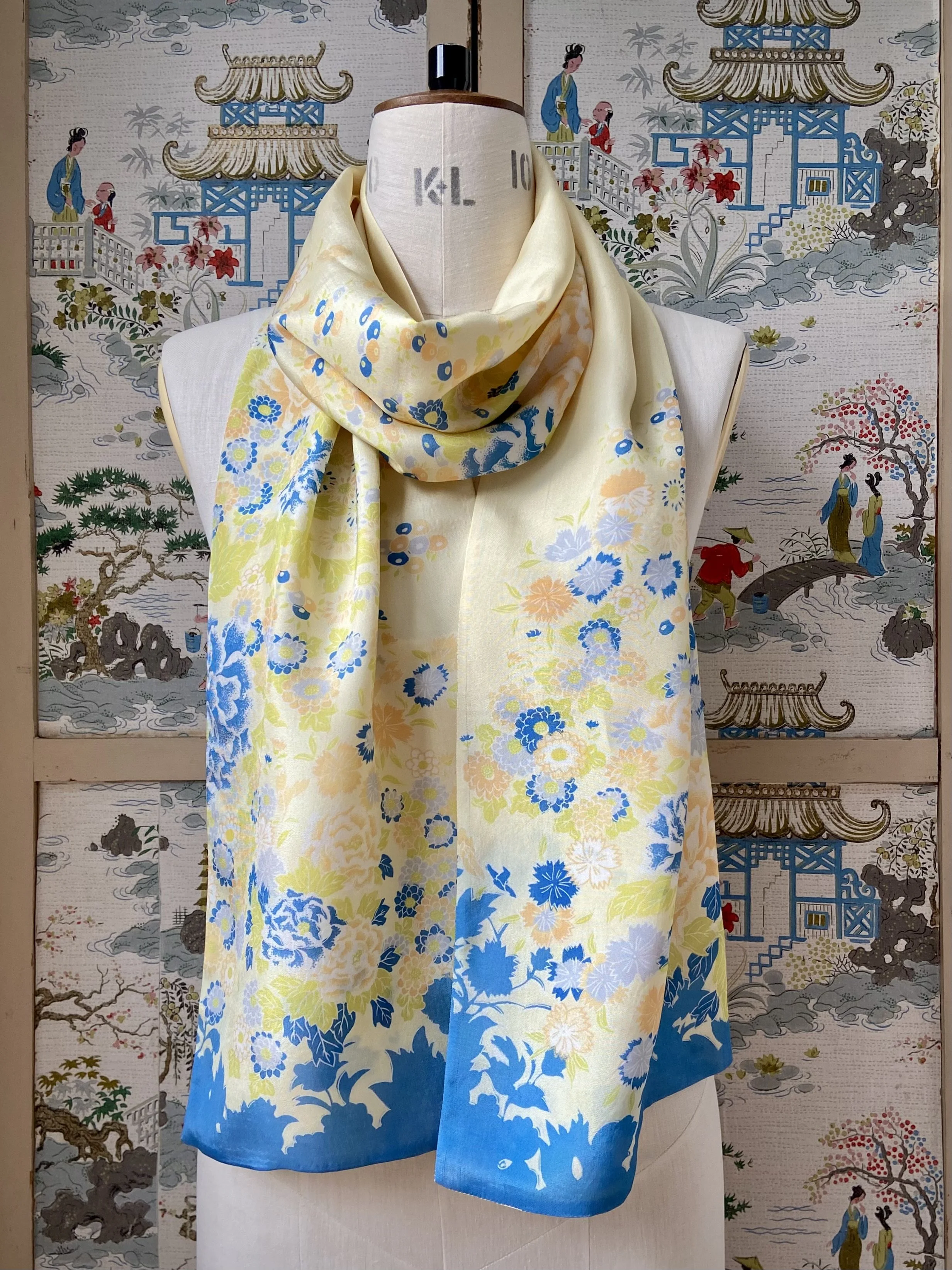 Yellow scarf with blossom print, presented on a dress stand, handmade from vintage kimono fabric and silk satin by Kirsty Chivers