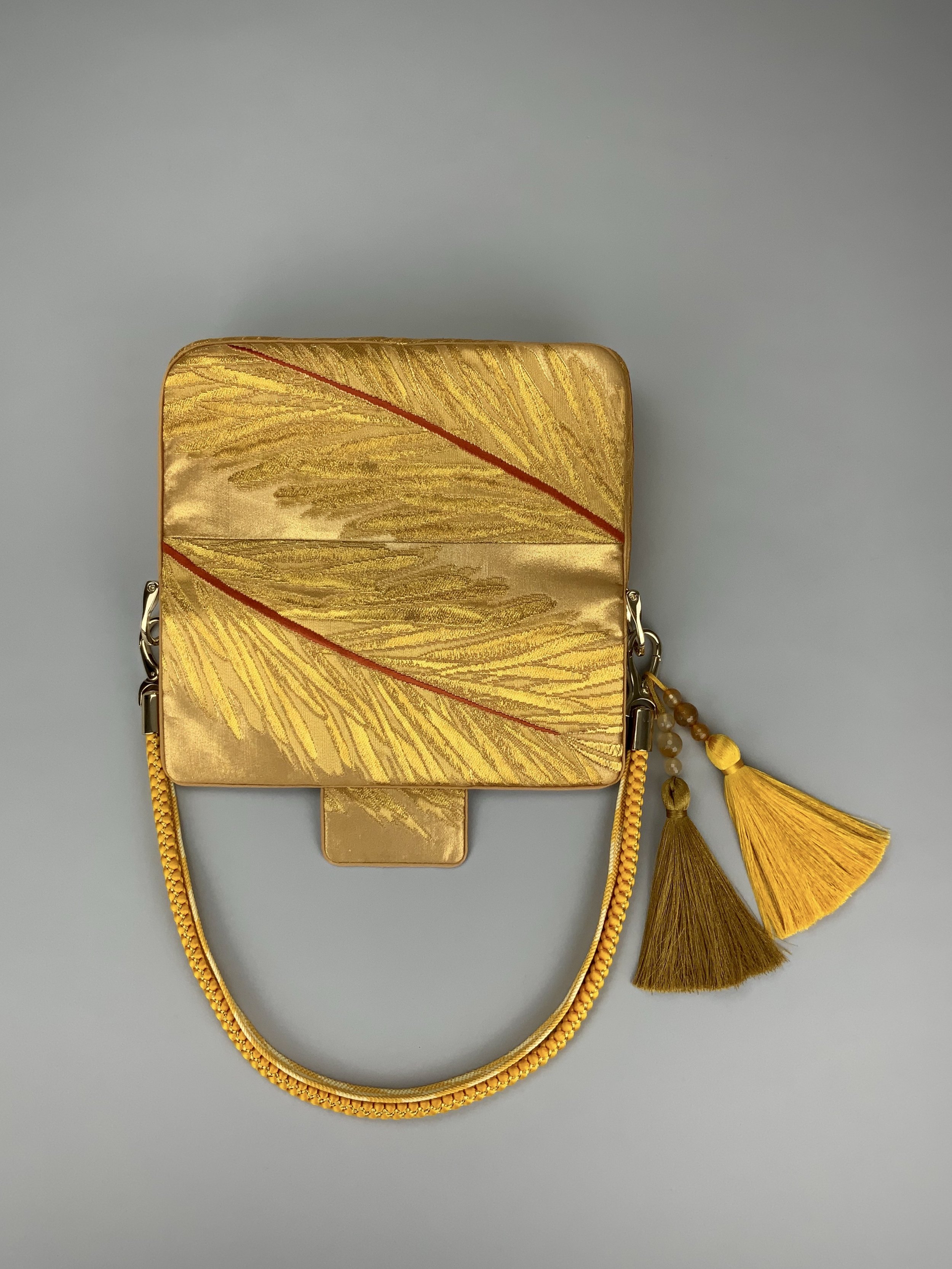 Lustrous metallic gold baguette evening bag made from vintage Japanese obi silk by Kirsty Chivers
