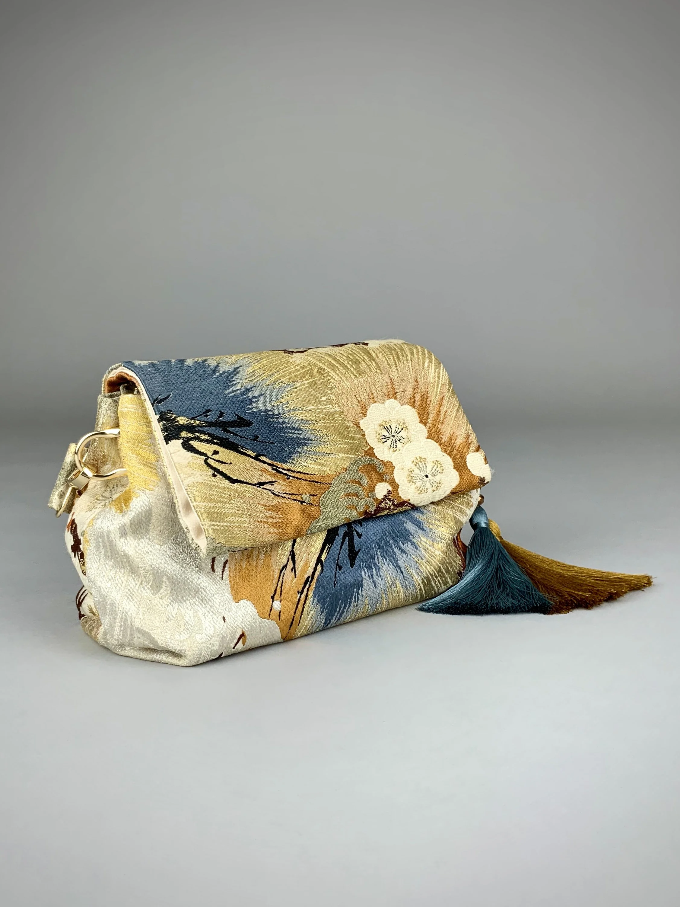 Metallic gold evening bag with Matsu pine and blossom design, made from vintage obi silk by Kirsty Chivers