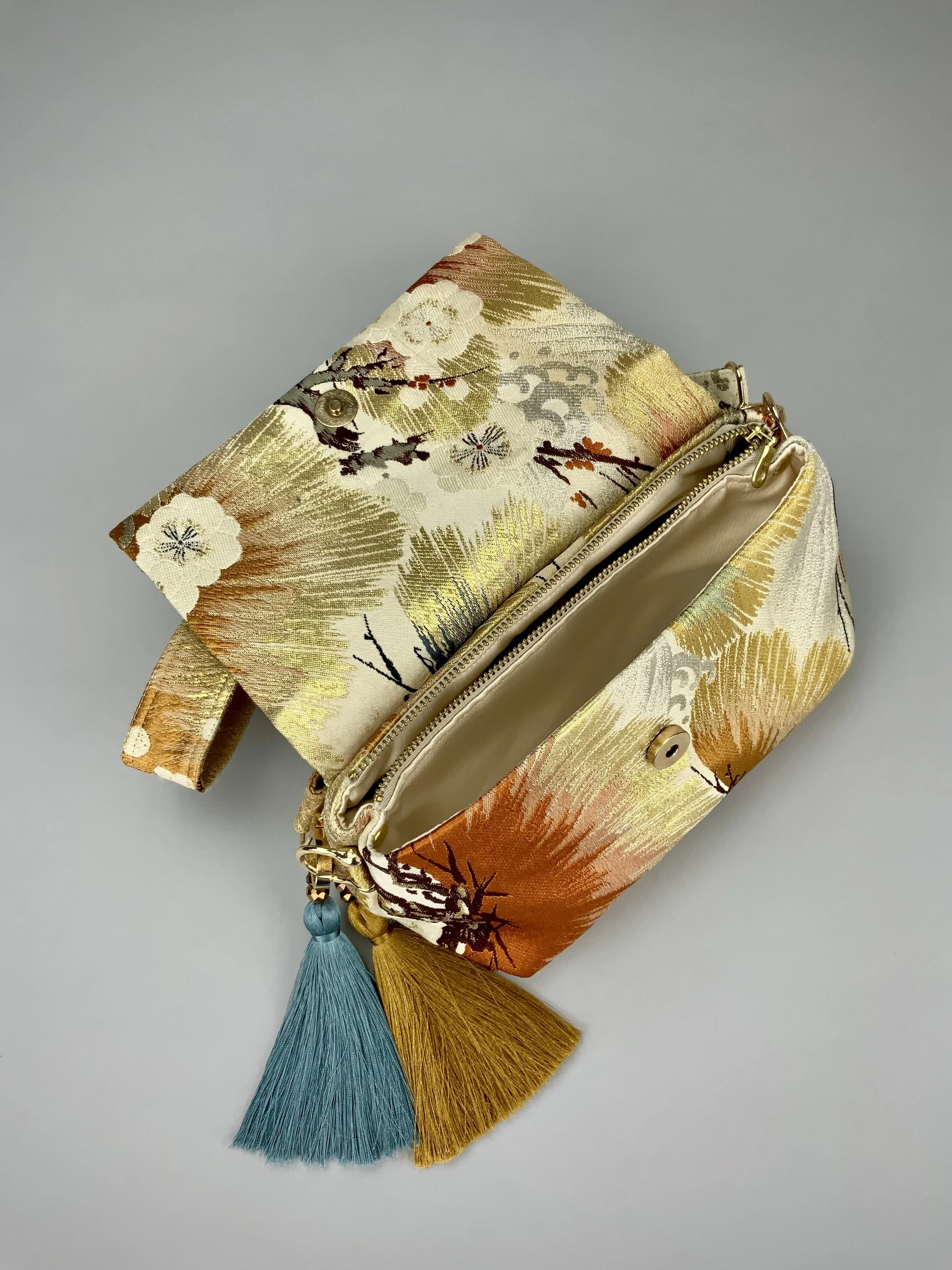 Metallic gold evening bag with Matsu pine and blossom design, made from vintage obi silk by Kirsty Chivers