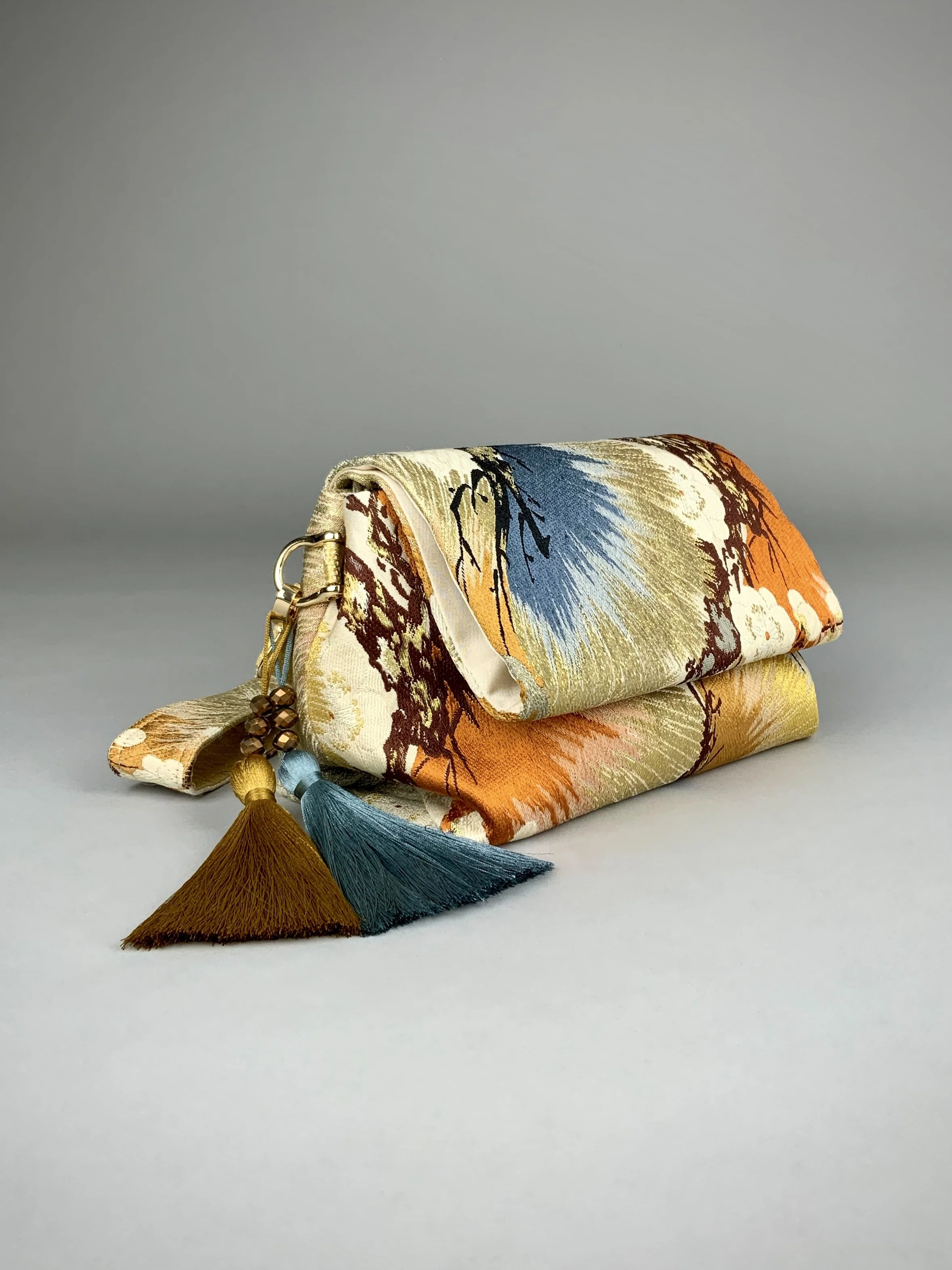 Metallic gold evening bag with Matsu pine and blossom design, made from vintage obi silk by Kirsty Chivers