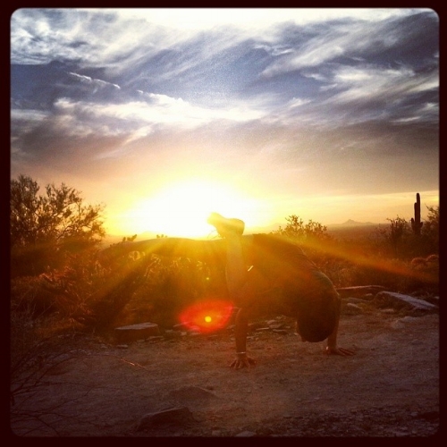 Yoga arm balance after a sunset hike in Arizona