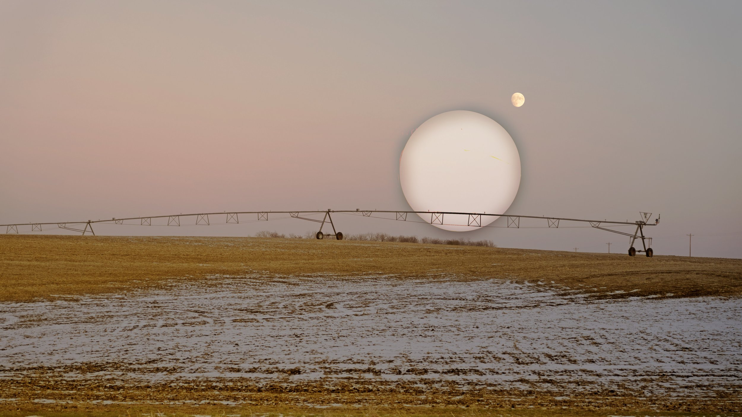 The Moon and Its Satellite Shine on the Wintry Cornfield.