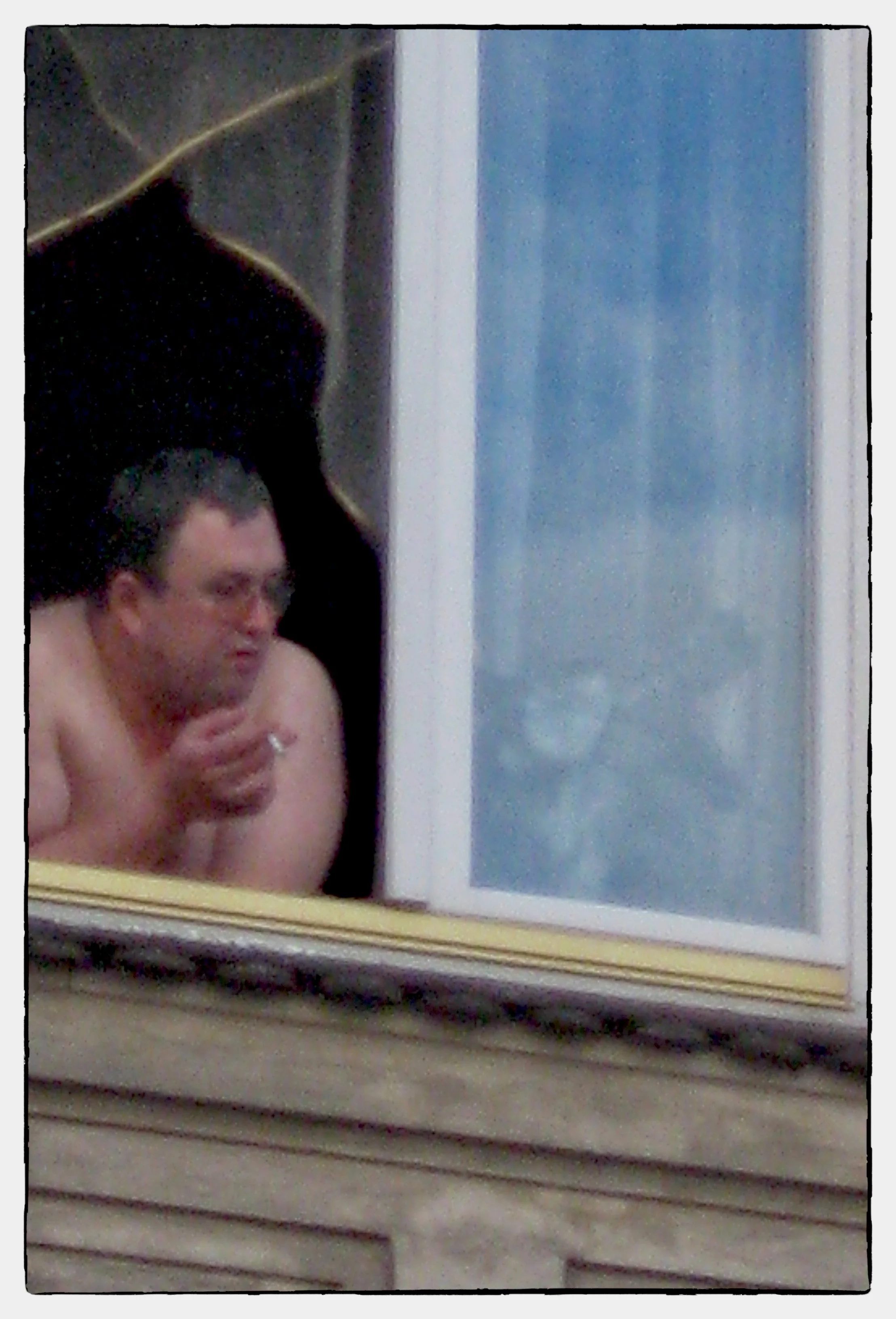 Man in Window, Kracow, Poland 