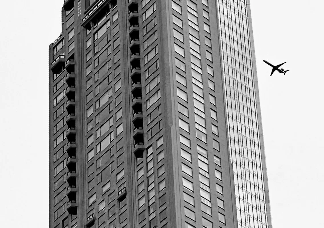 Plane Flies Near Building (Copy)