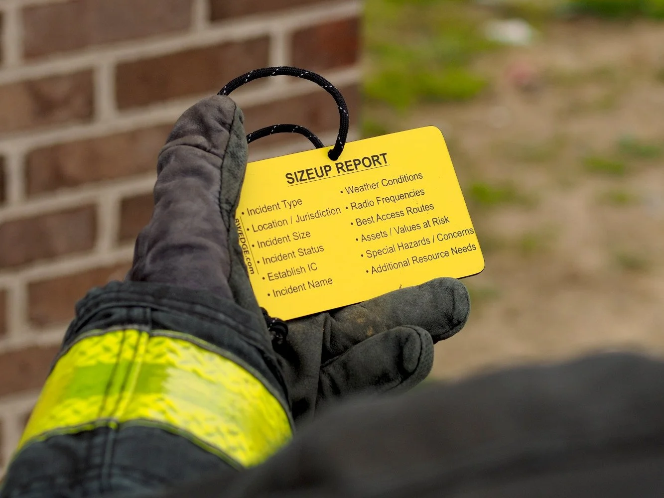 wildland fire size up report tag in use firefighter holding incident sizeup checklist tag during operation