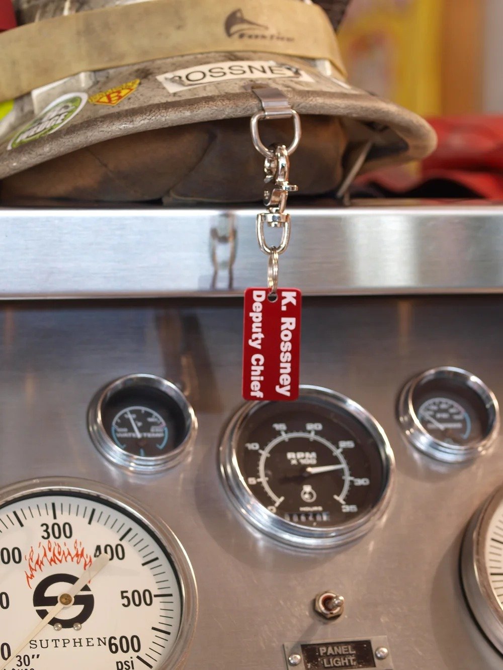 Firefighter accountability tags mounted inside fire apparatus dashboard for quick identification and tracking