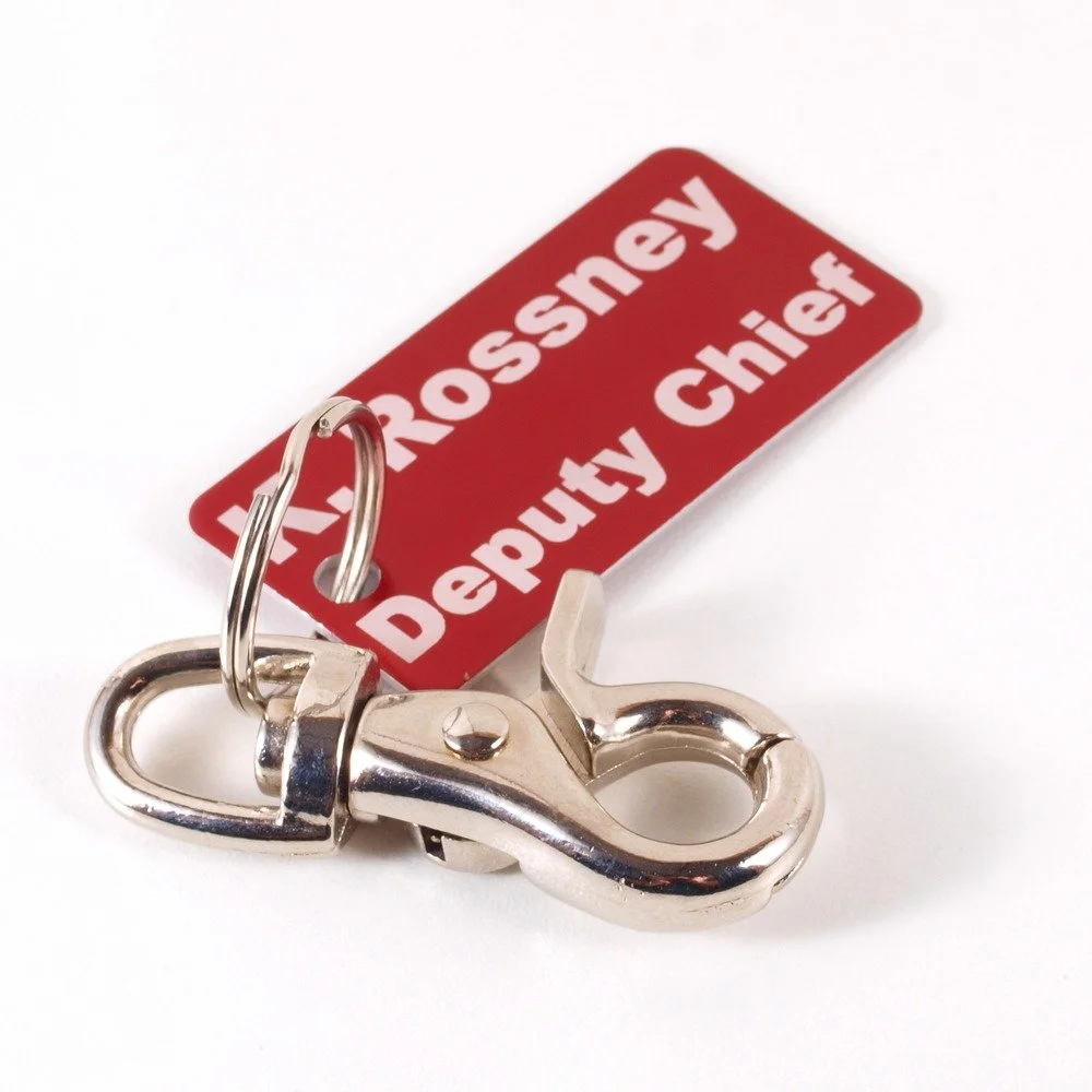 Custom firefighter ID tag engraved with rank Deputy Chief on red anodized aluminum accountability tag