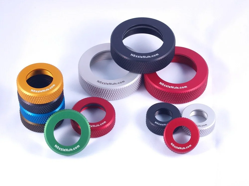 group of nozzle thread protectors showing different sizes and colors