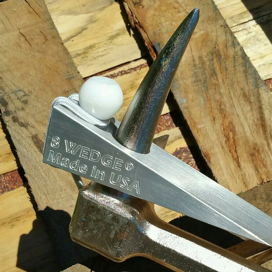 R.J. Machine 8 WEDGE aluminum firefighter door wedge mounted on a Halligan bar spike for forcible entry