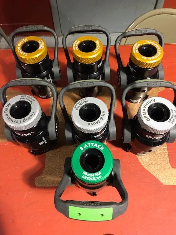 fire hose nozzles fitted with thread protectors for storage and protection