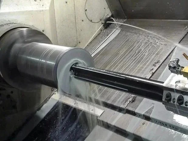 CNC lathe machining steel bar during turning operation