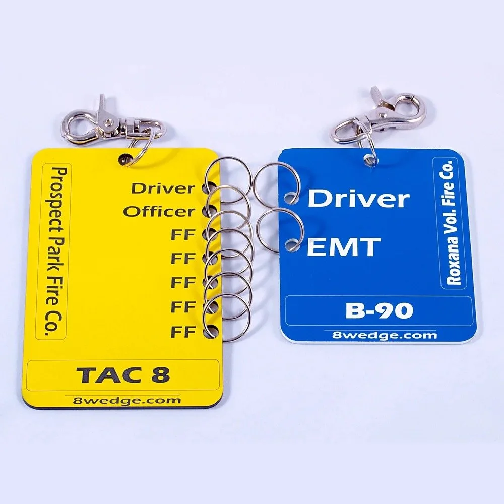 Firefighter apparatus ID tags labeled driver and EMT used for crew identification and accountability tracking