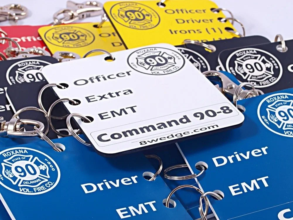 Custom fire apparatus tag sets for department accountability showing multiple roles and unit assignments