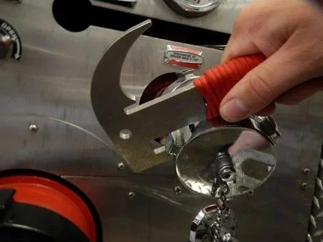 firefighter using TUF 8 multi tool on hydrant or hose connection in the field