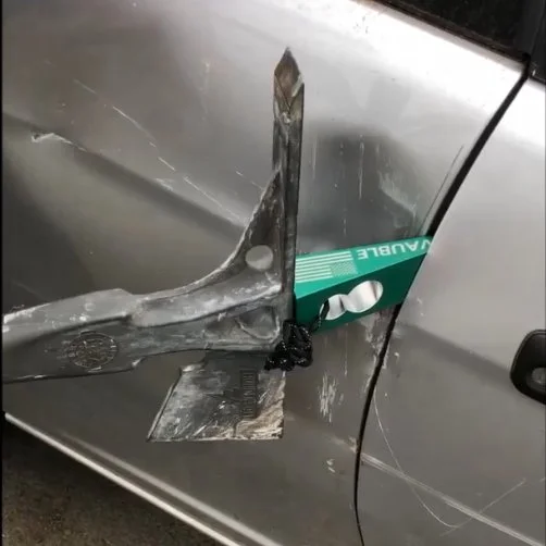 8 WEDGE firefighter forcible entry wedge tool in use forcing open a car door during vehicle entry operation