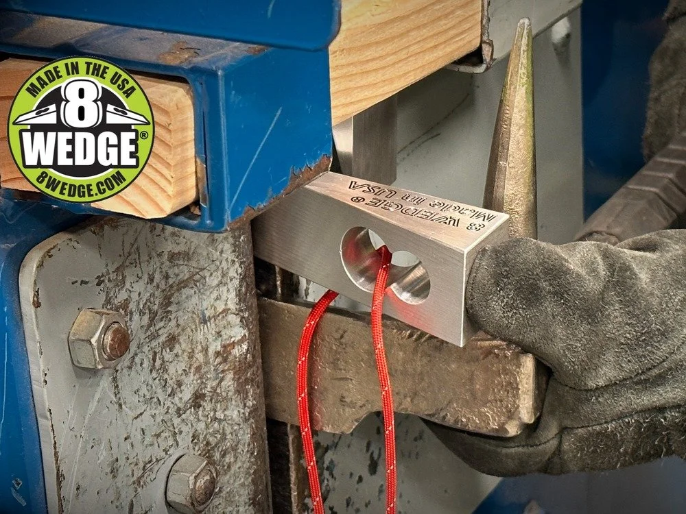 firefighter using 8 wedge tool with gloved hand during forcible entry