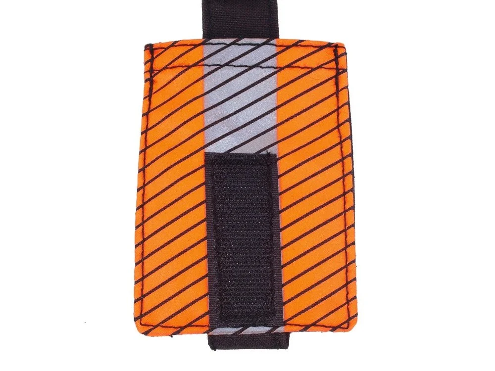 STRP firefighter tool pouch front view showing high visibility material and secure retention strap