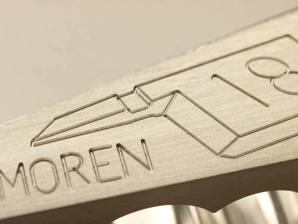 close up of custom name engraving on 8 wedge firefighter door wedge