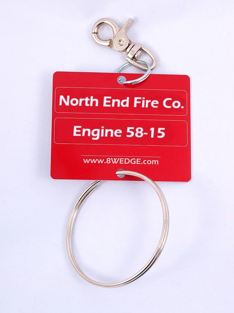 Custom engraved truck tags showing department name and apparatus identification
