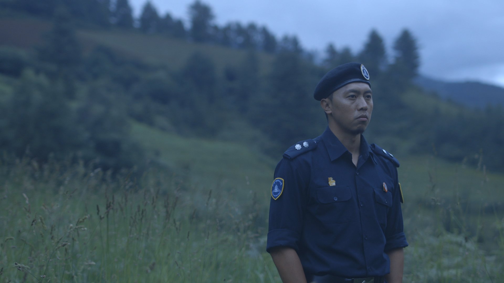 1_Jamyang Jamtsho Wangchuk as Kinley_ police detective in HONEYGIVER AMONG THE DOGS.jpg