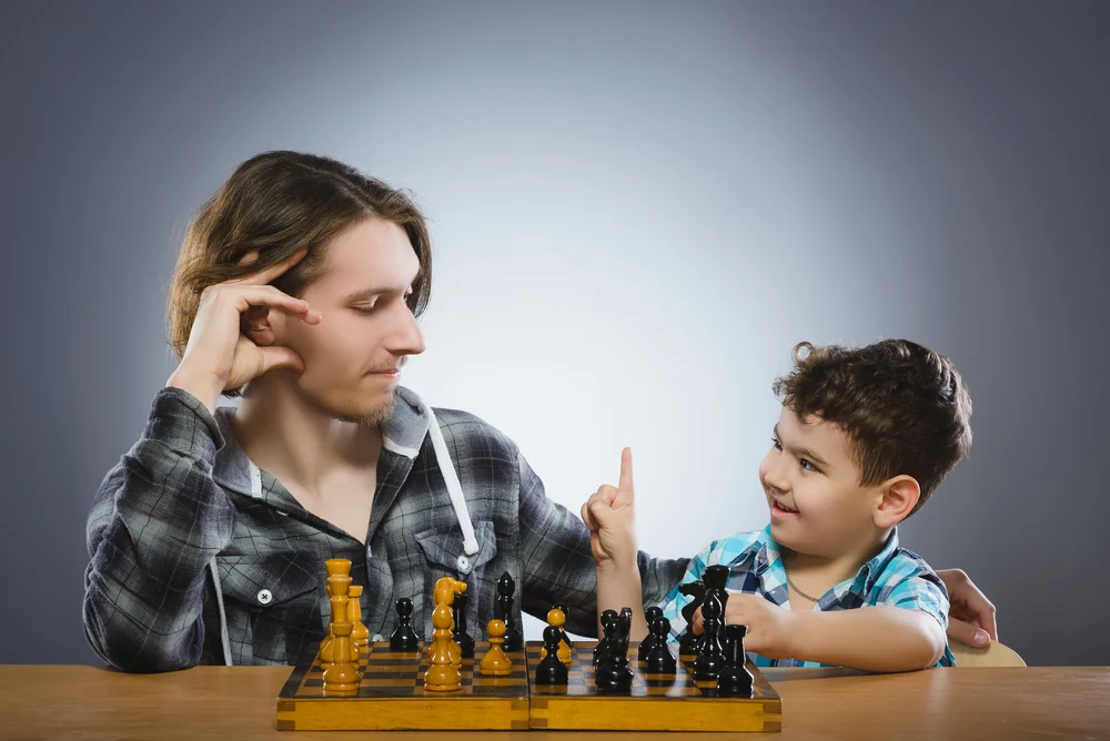 man-play-chess-with-boy.jpg