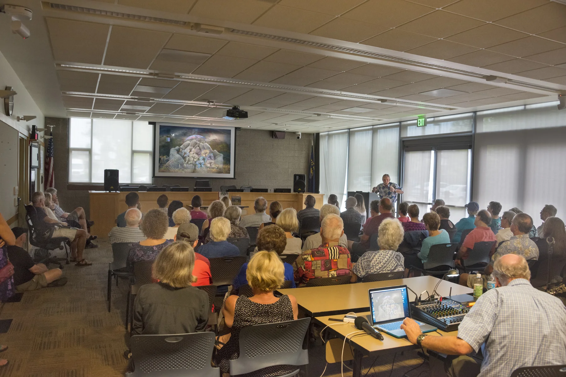 World-class sound man Edward R. Vidinghof interjects music and sound effects during this live presentation at the Sherwood Library Community Room. Music can enhance the emotional impact of the visual presentation. This talk was in conjunction with the Rotary Club's Peace Effort during Peace Month. 