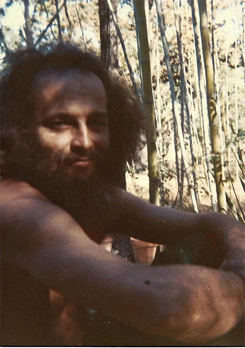 Kurt loved being shirtless and sometimes called himself "the brown bod." He could pass for Mexican, Afghan, or madman. Here he's sitting on the rear deck adjacent to the bamboo grove.