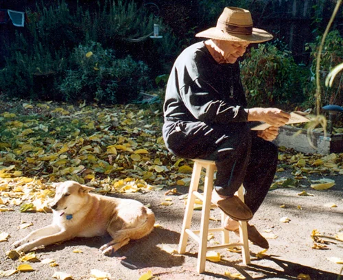 Here's Kurt enjoying his garden with Tasha, a Carolina Wild Dog, the last of his canine companions.