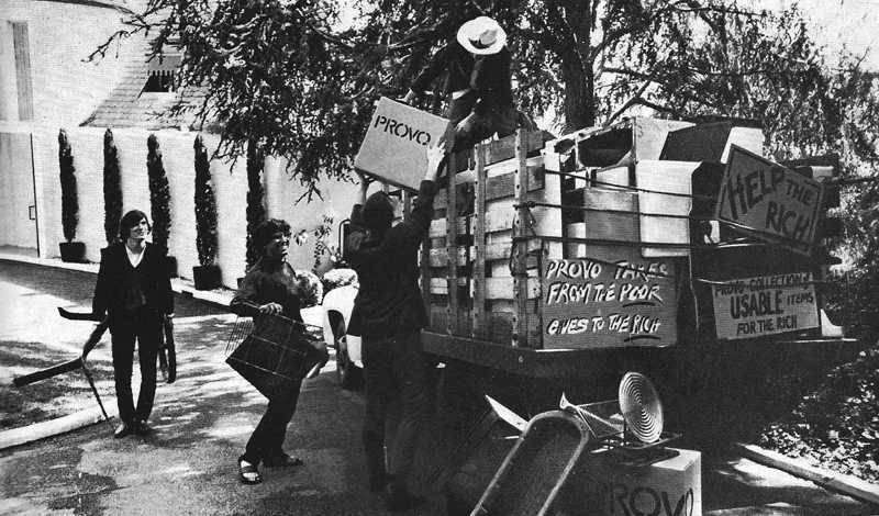 LA Provos Joseph Byrd, Peter Leaf, Michael Agnello and Dan Kabalevsky distributing household articles collected in the lower income district of Watts to the rather more prosperous residents of Beverly Hills and Hollywood.