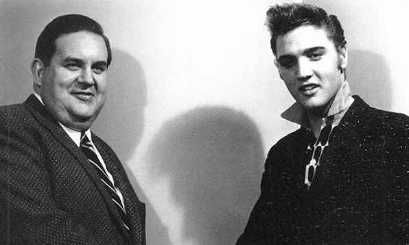 Elvis with Steve Sholes, RCA Victor's specialty record chief.
