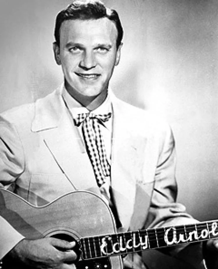 C&W singer Eddy Arnold was voted most popular in a disk jockey poll of 1956.