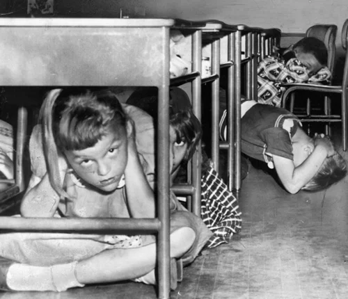 "Duck and Cover" drills in preparation for nuclear war were common for American school children of the mid-fifties.