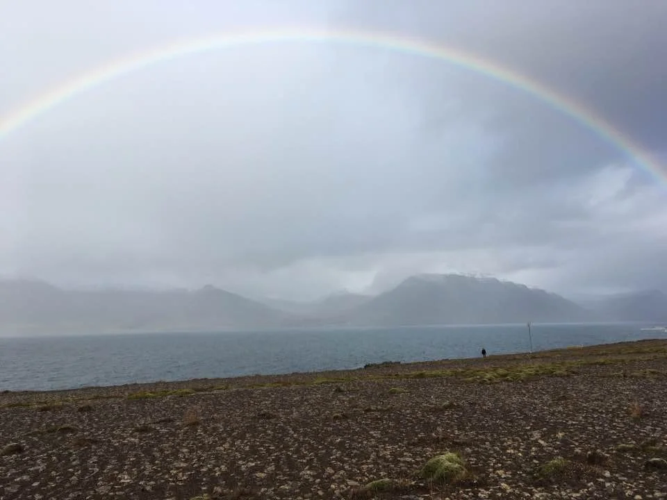 One of the many rainbows. For perspective, I’m that tiny black dot on the beach.