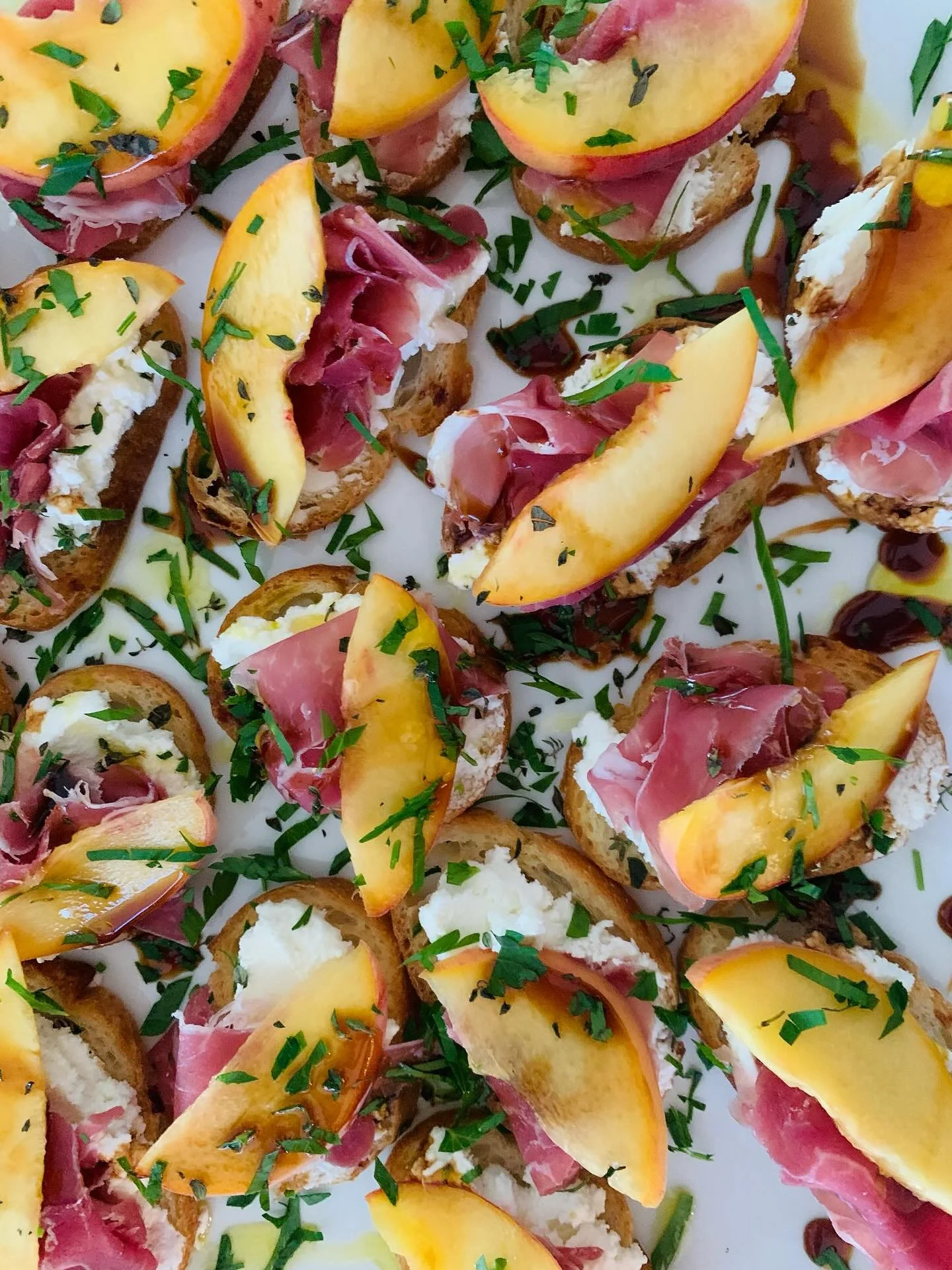 Simple summer crostini for cocktail hour. @henleysorchardva 🍑