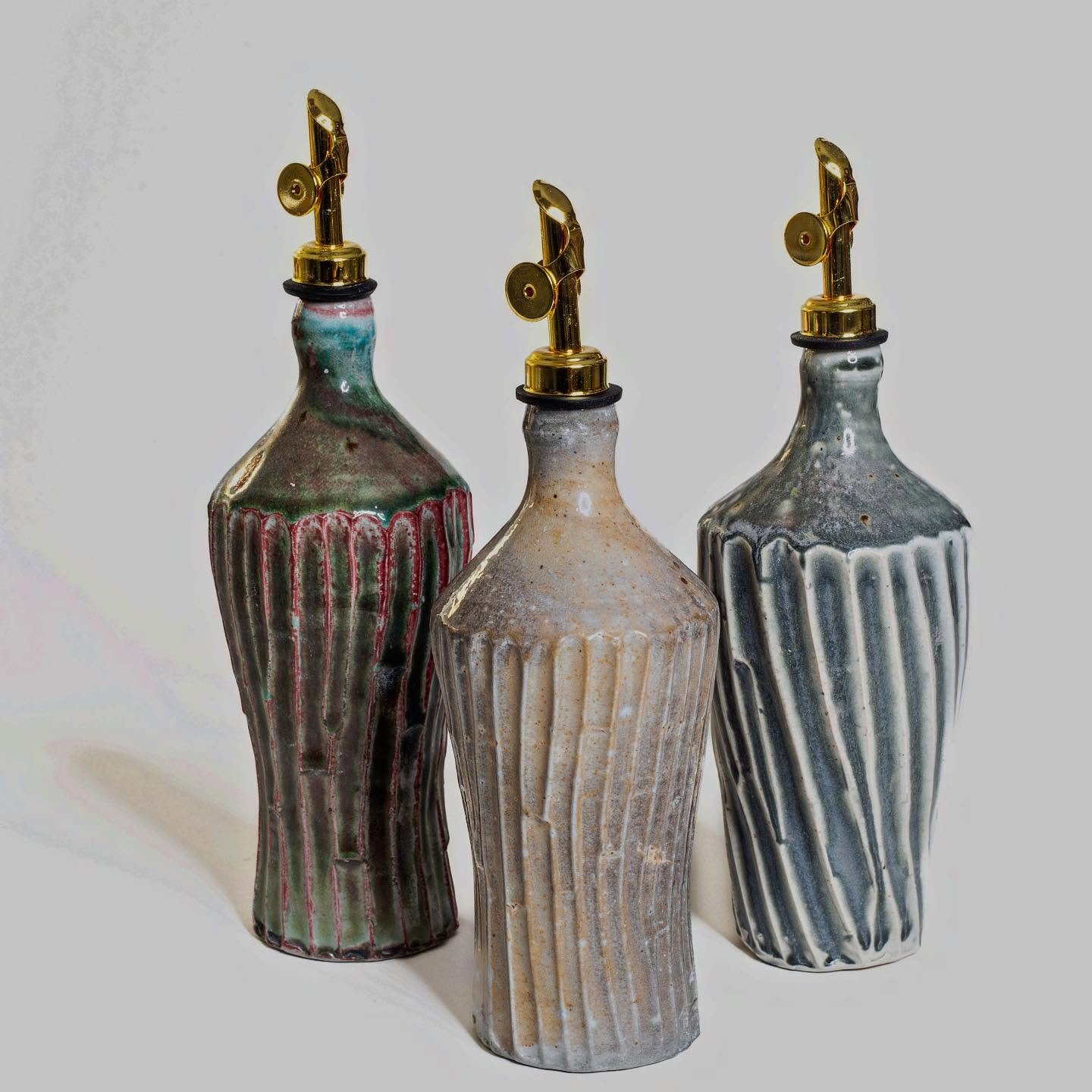 Some really nice bottles just out of the kiln!

#evoo #oliveoil #pourer #bottle #pottery #sodafired #dirtyporcelain #durham #maker #cooking