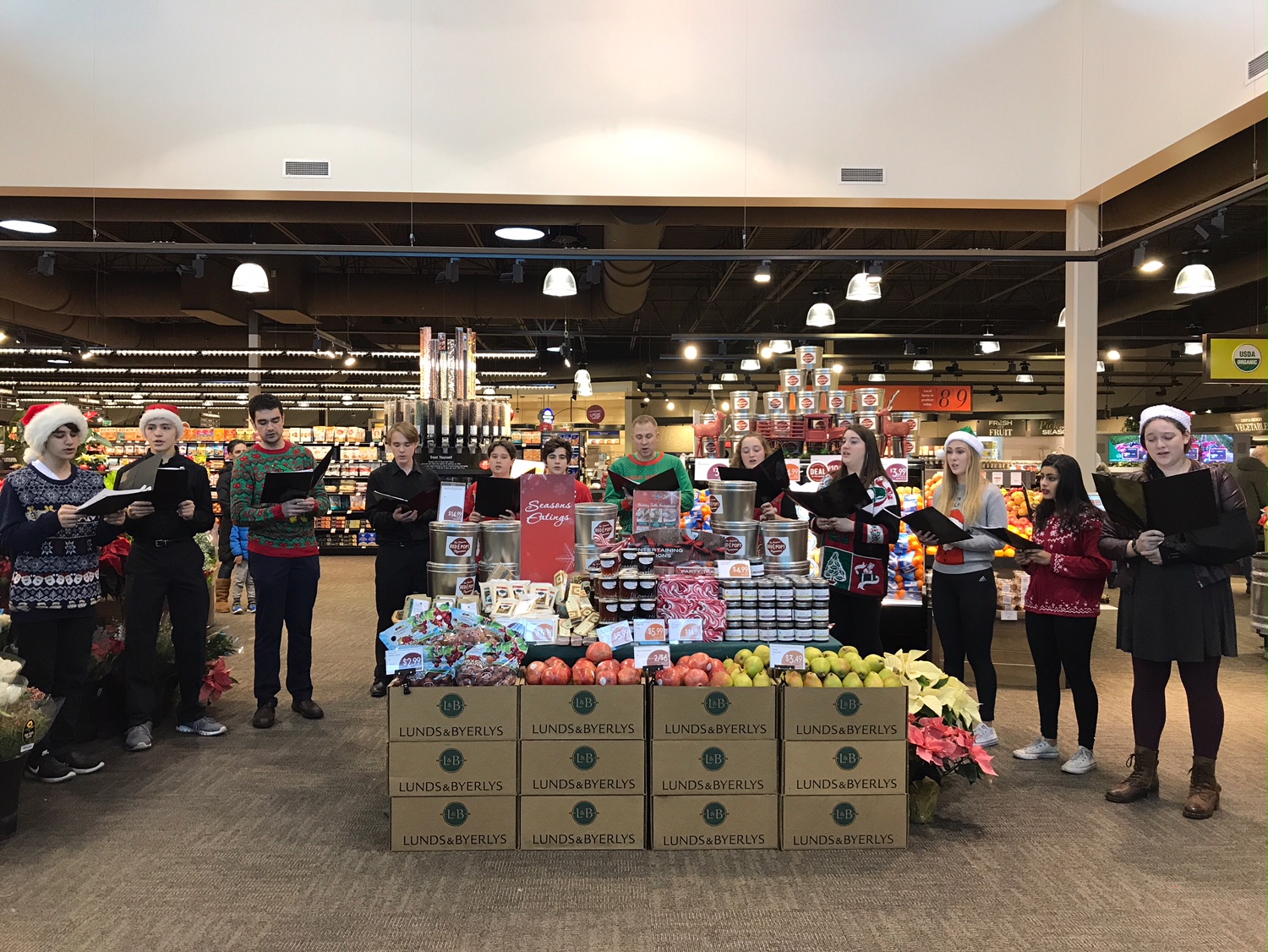 Members of TTB & SSA Ensembles and their directors caroling at Lunds & Byerlys.