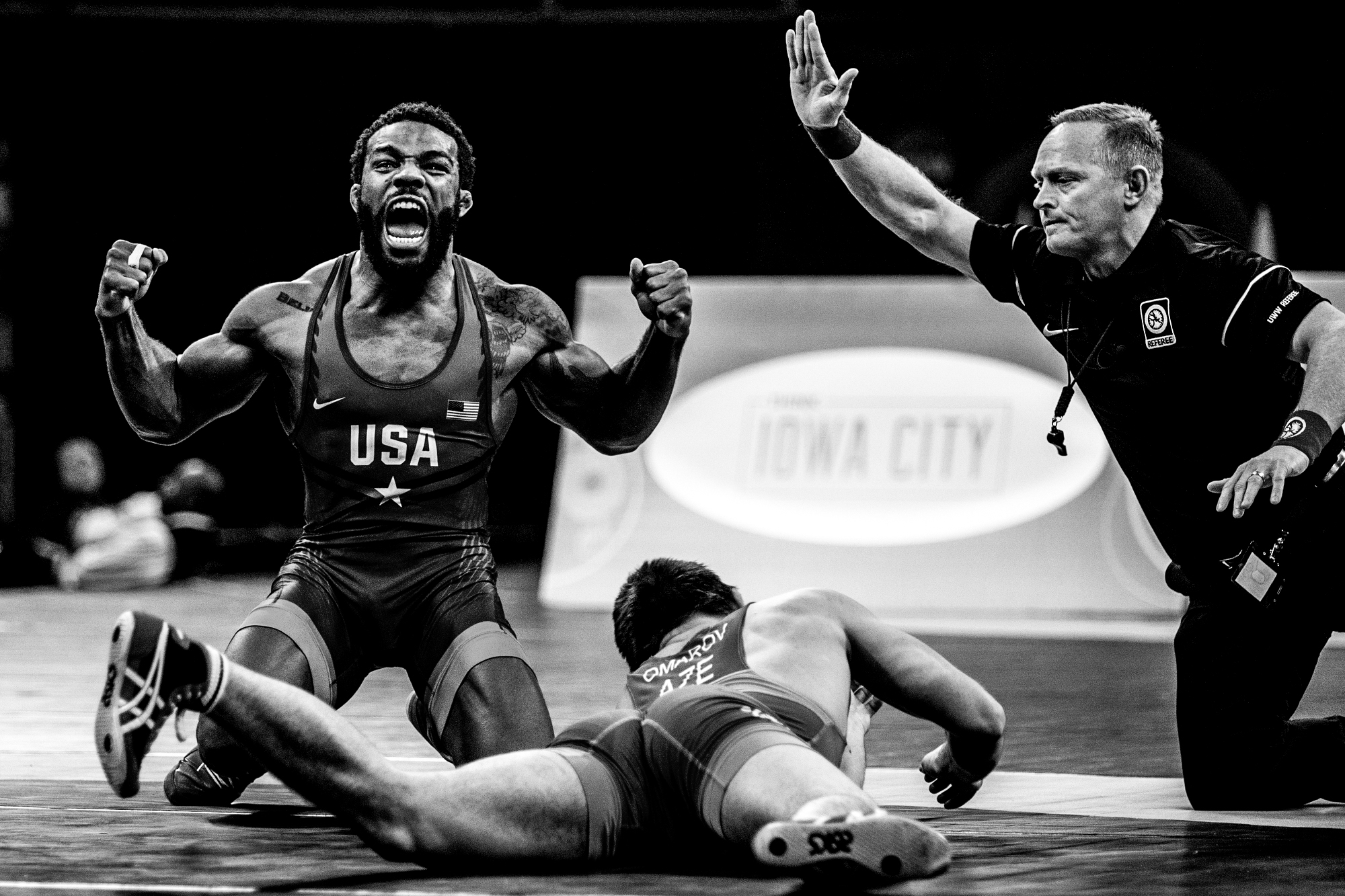  America's Jordan Burroughs, left, celebrates his victory over Azerbaijan's Gasjimurad Omarov in a 74 kg bout during the final round of the 2018 Men's Freestyle World Cup at Carver-Hawkeye Arena, Saturday, April 7, 2018 in Iowa City. 