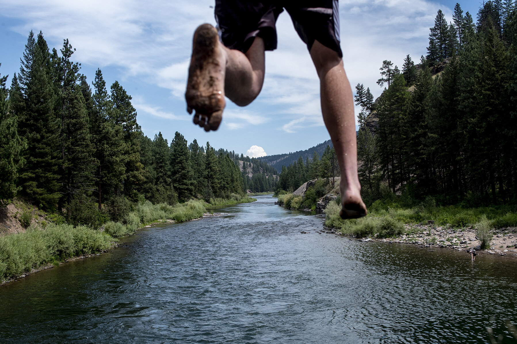  Gabriel Schwartz jumps off a cliff into the Blackfoot River at the Johnsrud Park Fishing Access Site, Tuesday, July 23, 2019. With temperatures soaring into the mid-90s, the Blackfoot Corridor offers reprieve from the hot Summer Sun with various rec