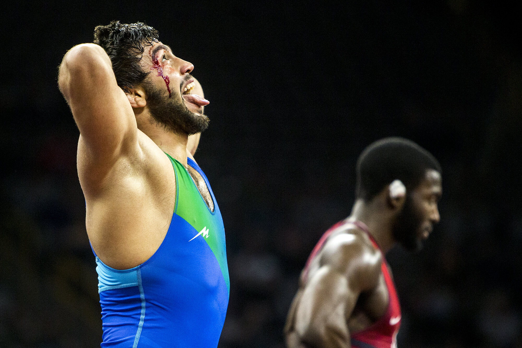  Joshgun Azimov (blue) of Azerbaijan reacts to his victory over America's James Green at 70 kg during the final round of the 2018 Men's Freestyle World Cup at Carver-Hawkeye Arena, April 7, 2018 in Iowa City, Iowa. 