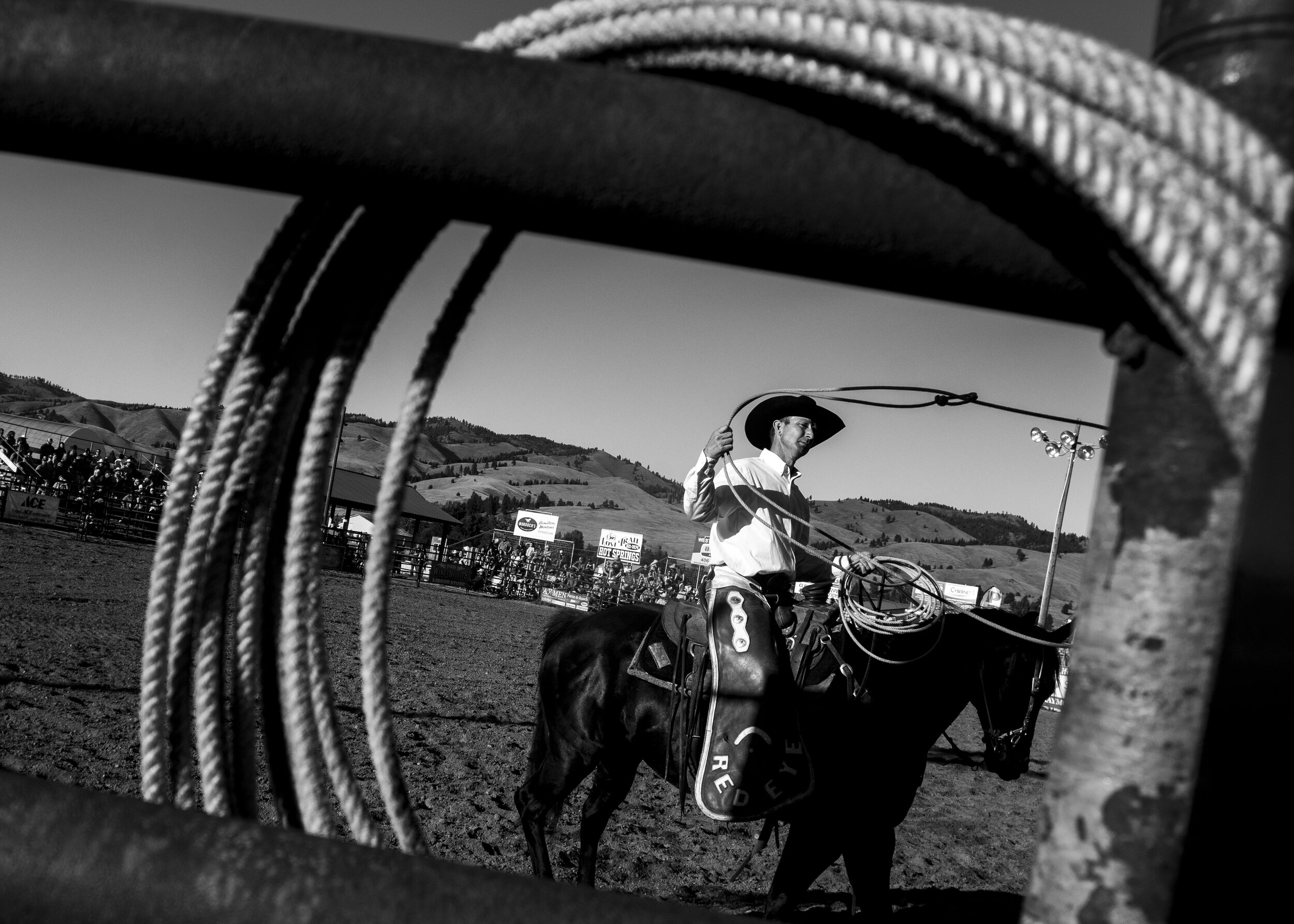  Kaehl Berg, owner of cattle contracting company Red Eye Rodeo, sits on his horse while waiting for the next bull rider at the Twisted Nut Rodeo, July 7, 2020 in Darby, Mont. The Twisted Nut Rodeo is an annual benefit for testicular cancer. 
