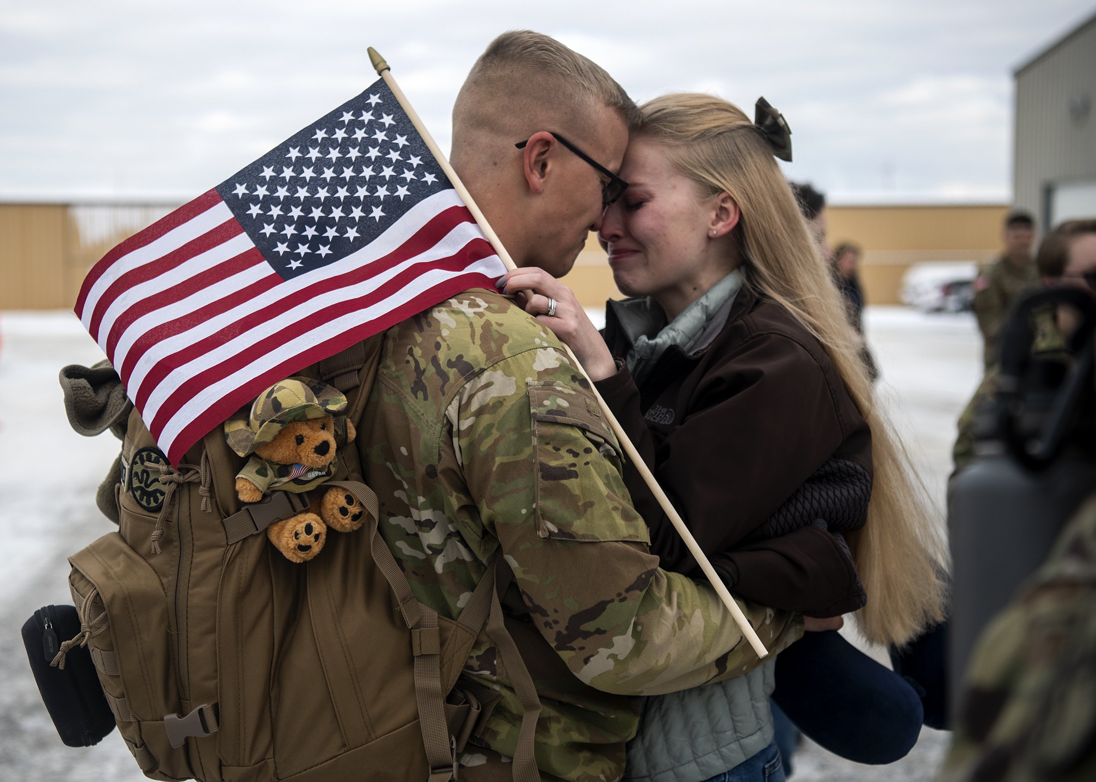  Jane Schweitzer, right, embraces her husband Specialist Kaedin Schweitzer as Montana Army National Guard's 163rd Combined Arms Battalion returns to Montana at Minuteman Aviation in Missoula, Mont., Thursday, Nov. 10, 2022. The battalion spent over a