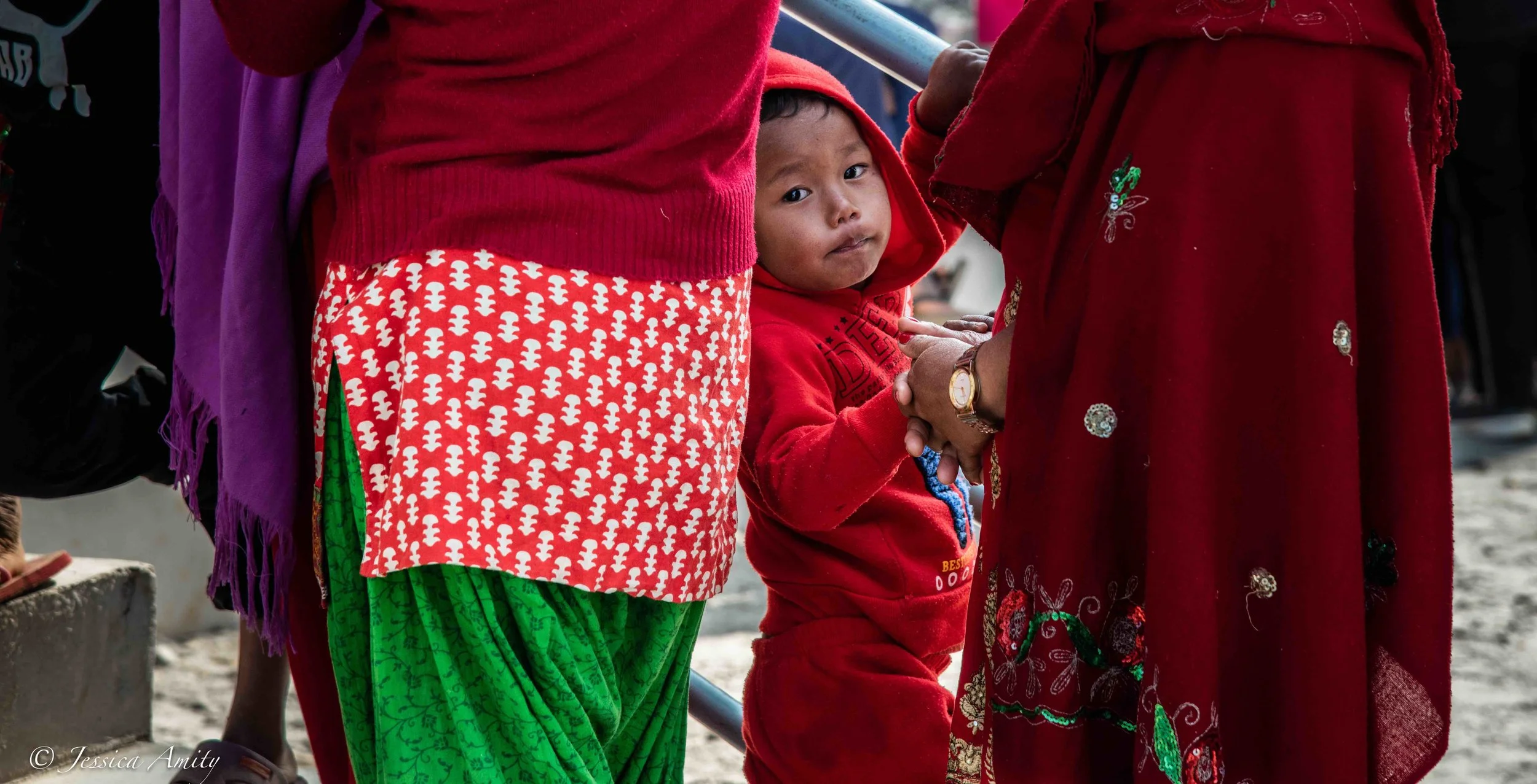 Children are among the many waiting in line at the opening of the medical camp.