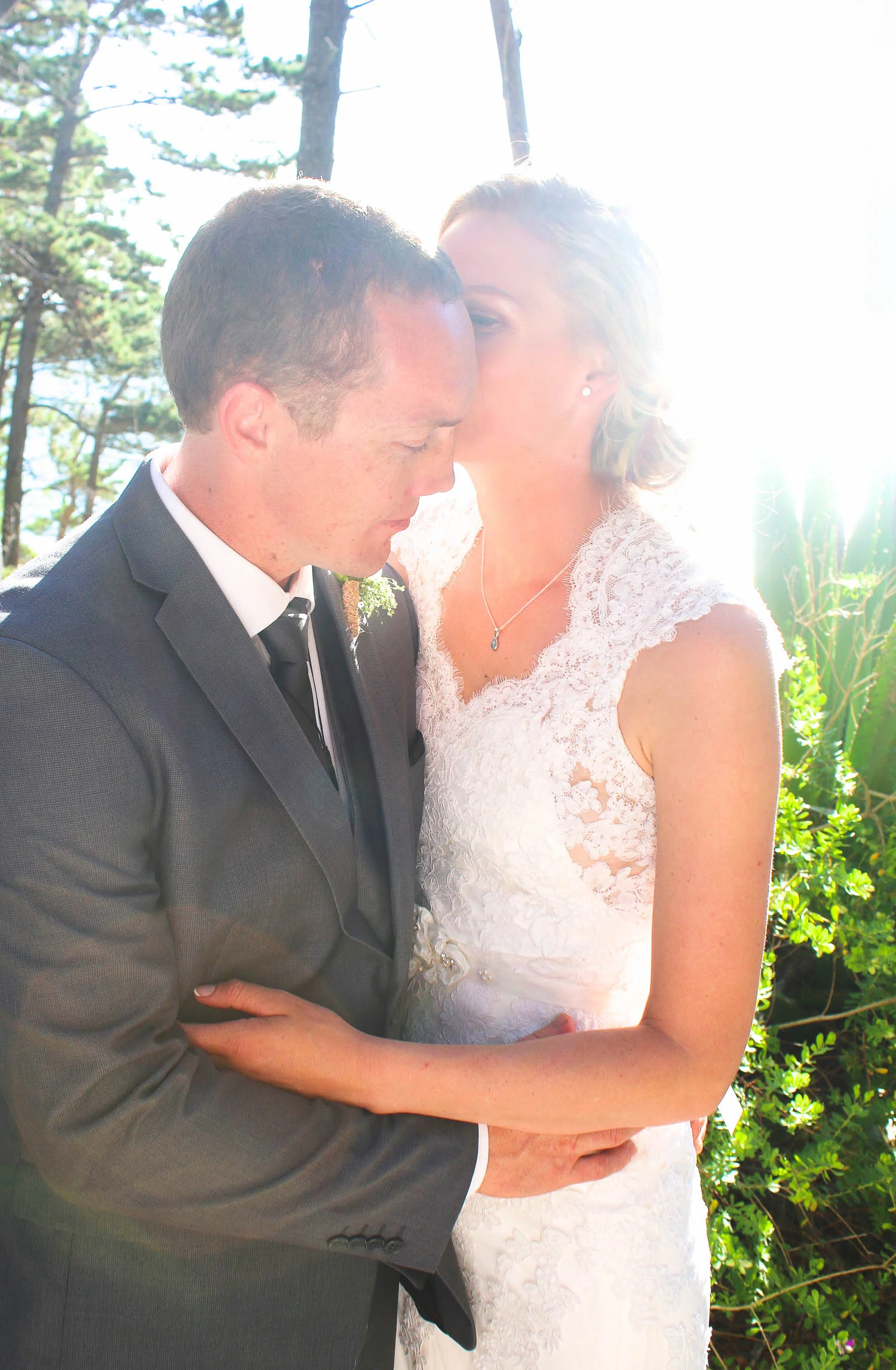 Bride_and_Groom_hugging_on_wedding_day.jpg