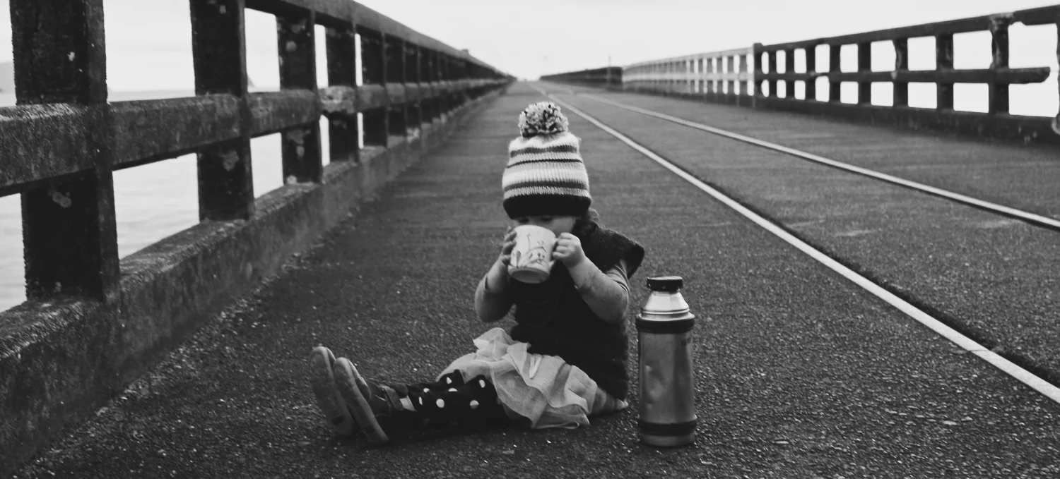 little-girl-winter-sunrise-enjoying-a-hot-cuppa-keeping-her-hands-warm.jpg